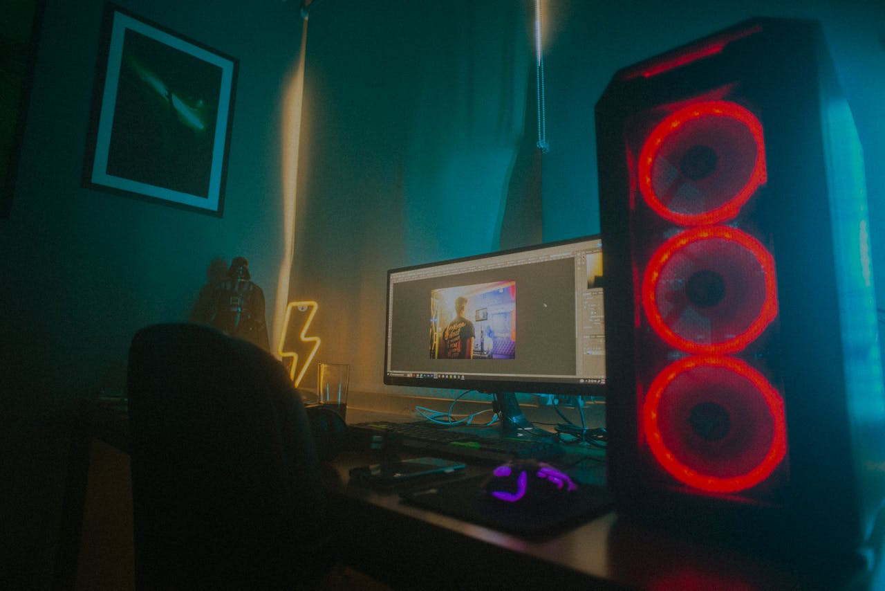 Crafting Captivating Headlines: Your awesome post title goes here Atmospheric photo of a gaming setup with a glowing PC case and monitor displaying content editing software.
